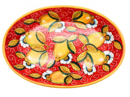 Bolo ovale in decoro limoni con ricciolo e fiori in rosso