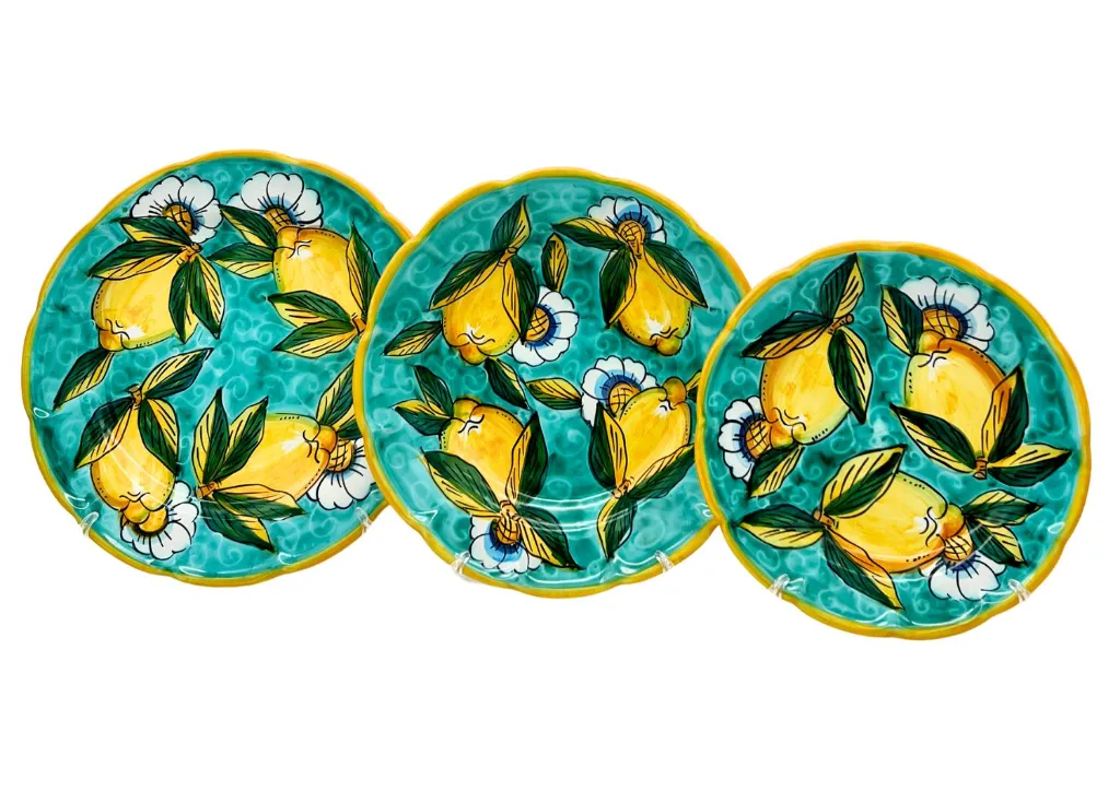 set piatti piano fondo frutta limone con ricciolo verde.webp